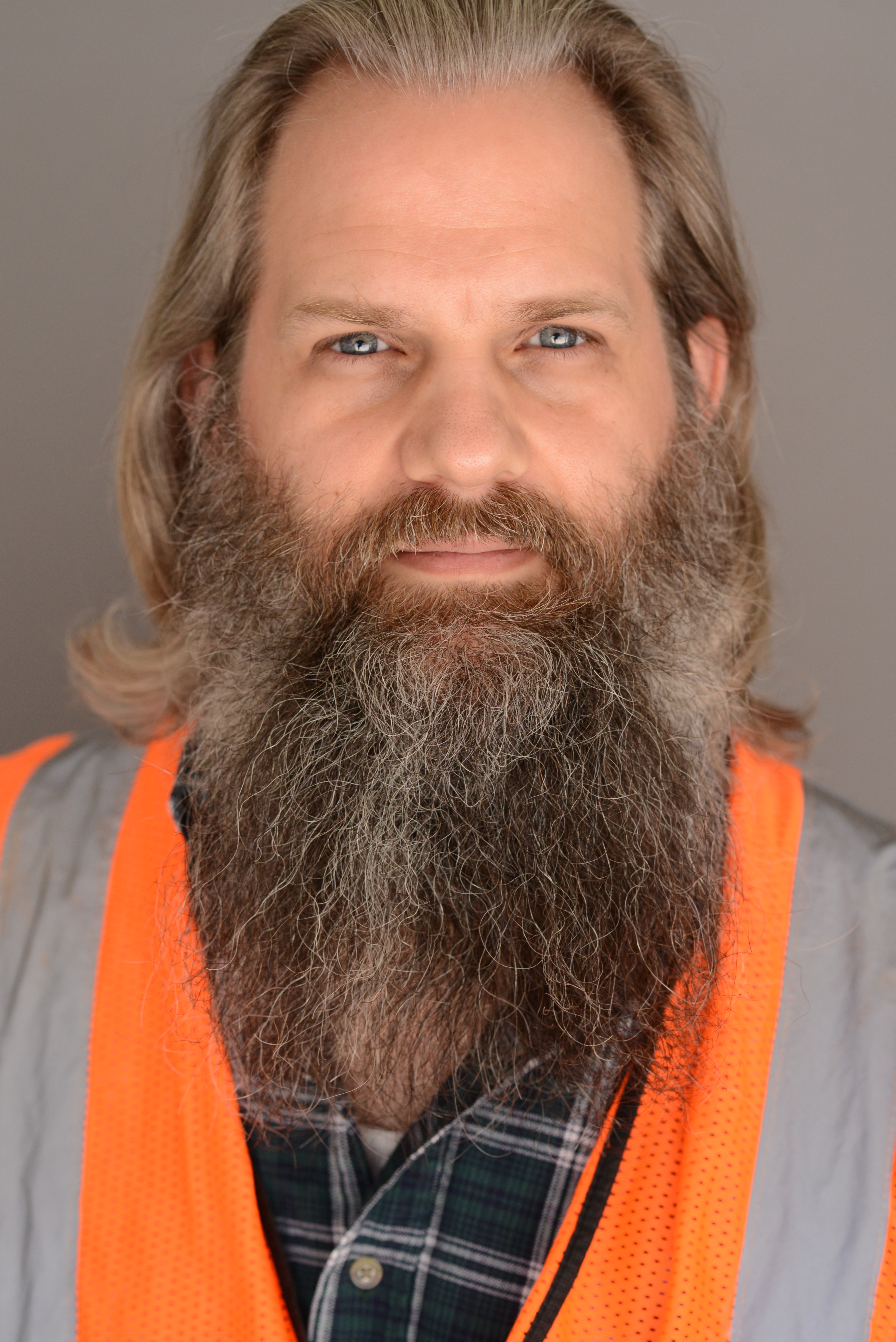 Bearded Man in in safety vest looking hot